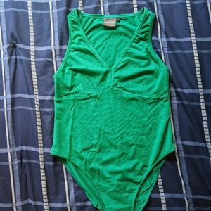 Richer Poorer green bodysuit